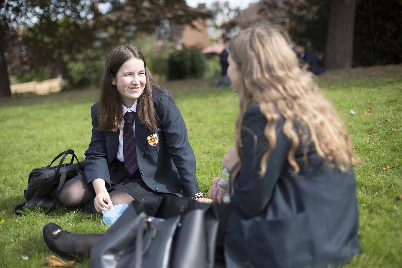 Image of students sat on the grass