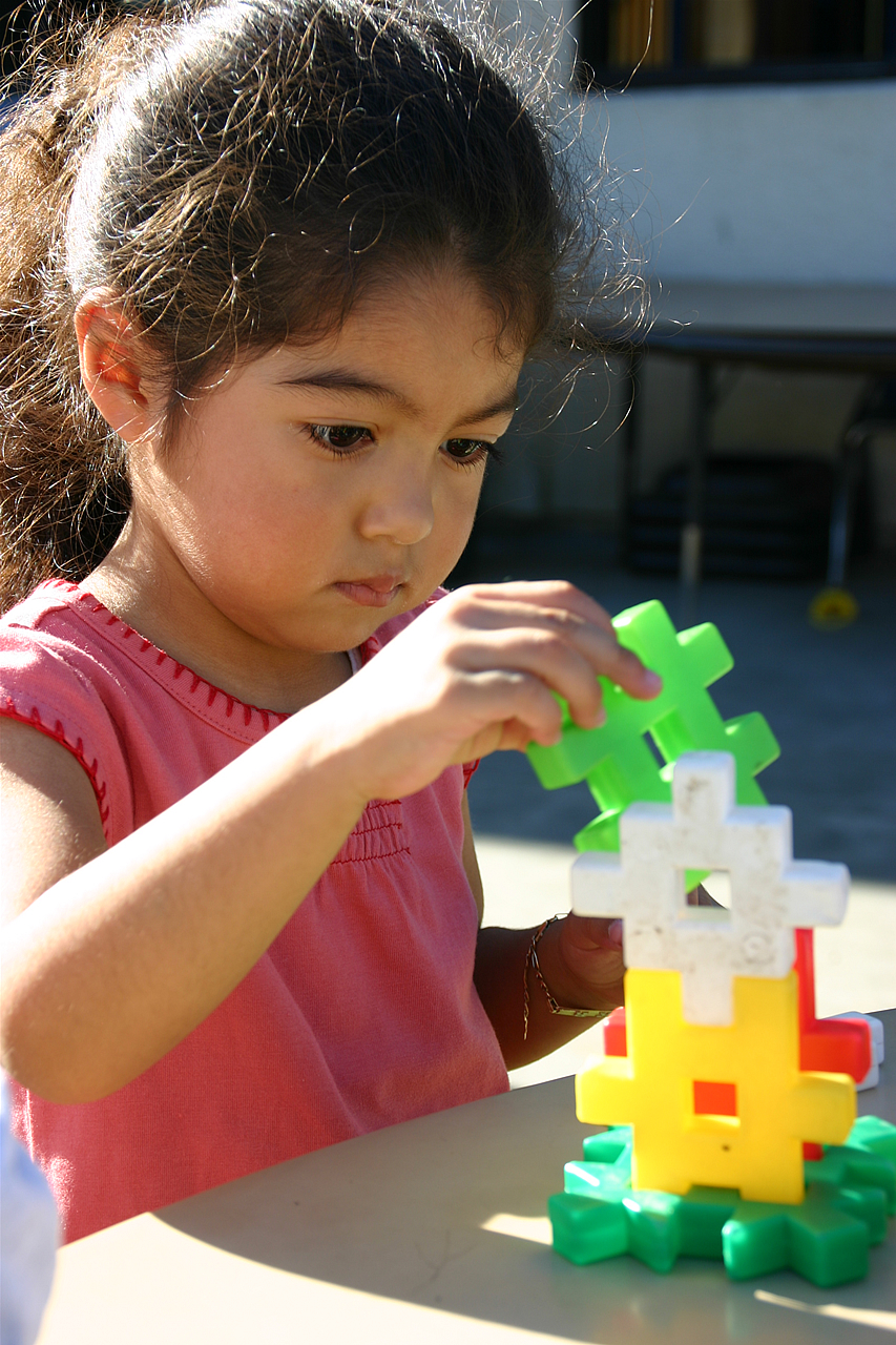 Image of a small child using building blocks